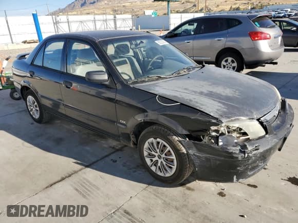 ✅ 2000 Mazda Protege DX • VIN: JM1BJ2220Y0239835 • Lot: 80228864. Wystawiony na Copart z przebiegiem 200 936 mil. Bezpłatny archiwum sprzedaży aukcyjnych z USA i szczegółowy raport historii pojazdu na DreamBid. Zdjęcie 4.