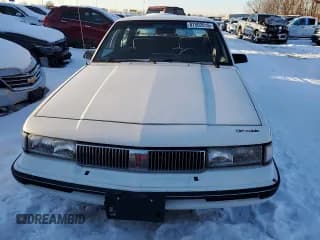 ✅ 1991 Oldsmobile Cutlass • VIN: 1G3AJ54N9M6353764 • Lot: 87502015. Listed on Copart with 170,646 mi. Free auction sales archive from the USA and detailed vehicle history report at DreamBid. Image 5.
