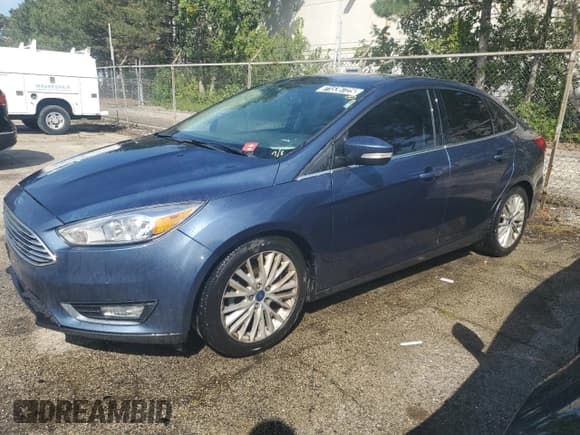 ✅ 2018 Ford Focus Titanium • VIN: 1FADP3J21JL285554 • Лот: 71536725. Опубликован ранее на Copart с пробегом 90 204 миль. Бесплатный доступ к архиву аукционных продаж из США и подробный отчёт об истории автомобиля на DreamBid. Изображение 1.