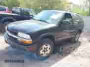 2003 Chevrolet Blazer LS z VIN 1GNCT18X83K145413, wystawiony jako IAAI lot #42239223 z przebiegiem 161 632 mil mil oraz . Historia ofert i sprzedaży dostępna na DreamBid. Obrazek 2.