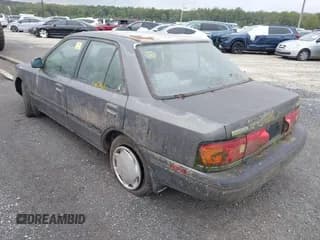 ✅ 1992 Mazda Protege • VIN: JM1BG2262N0508852 • Lot: 43184811. Wystawiony na IAAI z przebiegiem 152 900 mil. Bezpłatny archiwum sprzedaży aukcyjnych z USA i szczegółowy raport historii pojazdu na DreamBid. Zdjęcie 4.