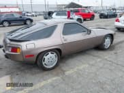 ✅ 1983 Porsche 928 • VIN: WP0JB0928DS860094 • Лот: 42106022. Опубликован ранее на IAAI с пробегом 121 873 миль. Бесплатный доступ к архиву аукционных продаж из США и подробный отчёт об истории автомобиля на DreamBid. Изображение 4.