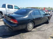 ✅ 1997 Nissan Maxima GXE • VIN: JN1CA21D5VT842395 • Lot: 42921259. Listed on IAAI with 142,158 mi. Free auction sales archive from the USA and detailed vehicle history report at DreamBid. Image 4.