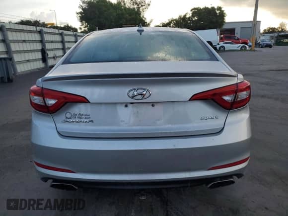 2015 Hyundai Sonata Sport с VIN 5NPE34AF0FH245464, выставлен на аукционе Copart как лот 90229915 с пробегом 152 471 миль миль и Списание • Salvage title. История ставок и продаж доступна на DreamBid. Изображение 6.
