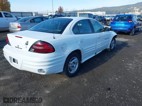 ✅ 1999 Pontiac Grand Am SE2 • VIN: 1G2NE52T7XM924776 • Lot: 43678442. Listed on IAAI with 154,923 mi. Free auction sales archive from the USA and detailed vehicle history report at DreamBid. Image 4.