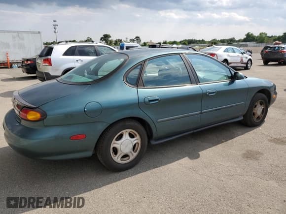 ✅ 1997 Ford Taurus GL • VIN: 1FALP52U4VA323402 • Lot: 65742235. Listed on Copart with 43,415 mi. Free auction sales archive from the USA and detailed vehicle history report at DreamBid. Image 3.