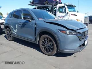 ✅ 2022 Mazda CX-5 S Carbon Edition • VIN: JM3KFBCM9N0600368 • Lot: 43565081. Listed on IAAI with 29,768 mi. Free auction sales archive from the USA and detailed vehicle history report at DreamBid. Image 1.