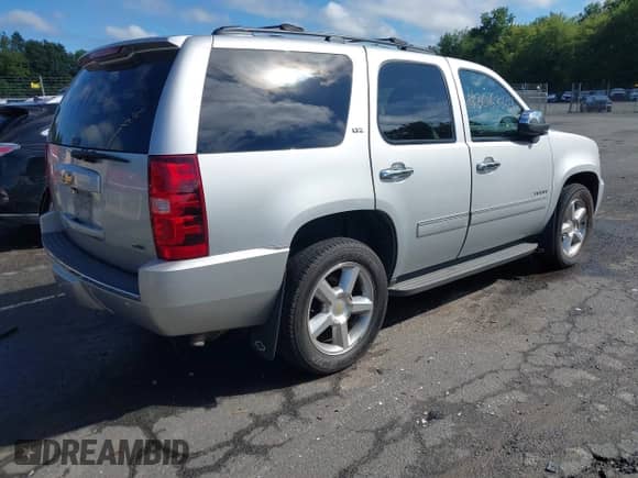 2011 Chevrolet Tahoe LTZ with VIN 1GNSKCE01BR231833, listed as a IAAI auction lot 43053303 with 247,341 mi miles and . Bid and sale history available at DreamBid. Image 4.