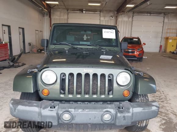 ✅ 2007 Jeep Wrangler Sahara • VIN: 1J4FA54187L125547 • Lot: 43487962. Listed on IAAI with 187,902 mi. Free auction sales archive from the USA and detailed vehicle history report at DreamBid. Image 12.