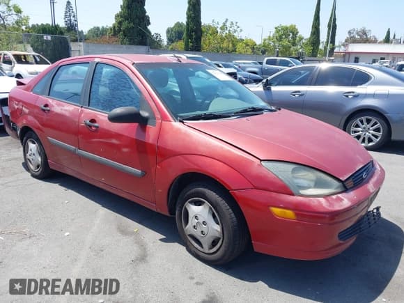 ✅ 2003 Ford Focus LX • VIN: 1FAFP33PX3W241880 • Lot: 42564941. Wystawiony na IAAI z przebiegiem 99 468 mil. Bezpłatny archiwum sprzedaży aukcyjnych z USA i szczegółowy raport historii pojazdu na DreamBid. Zdjęcie 1.