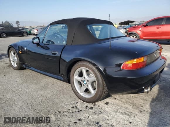 ✅ 1999 BMW Z3 2.5 • VIN: 4USCH9332XLF81796 • Lot: 87218624. Listed on Copart with 78,476 mi. Free auction sales archive from the USA and detailed vehicle history report at DreamBid. Image 2.