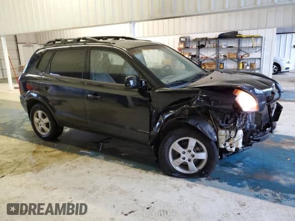 2005 Hyundai Tucson GL z VIN KM8JM12BX5U205060, wystawiony jako Copart lot #71282644 z przebiegiem 243 076 mil mil oraz Szkoda całkowita • Salvage title. Historia ofert i sprzedaży dostępna na DreamBid. Obrazek 4.