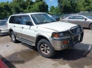 ✅ 1999 Mitsubishi Montero Sport Limited • VIN: JA4MT41R2XP026396 • Lot: 42805074. Wystawiony na IAAI z przebiegiem 124 730 mil. Bezpłatny archiwum sprzedaży aukcyjnych z USA i szczegółowy raport historii pojazdu na DreamBid. Zdjęcie 1.