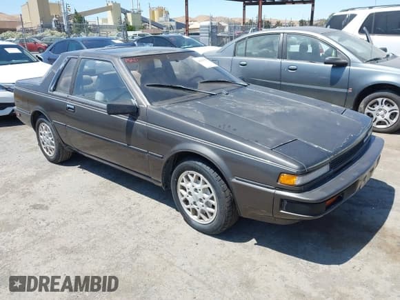 ✅ 1986 Nissan 200SX • VIN: JN1PS24S7GW112725 • Лот: 42533555. Опубликован ранее на IAAI с пробегом 74 240 миль. Бесплатный доступ к архиву аукционных продаж из США и подробный отчёт об истории автомобиля на DreamBid. Изображение 1.