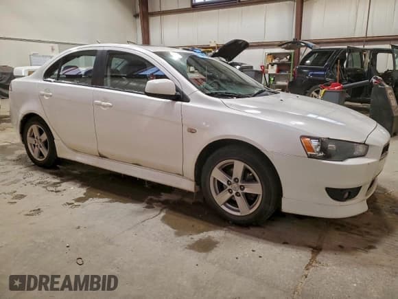 ✅ 2014 Mitsubishi Lancer ES • VIN: JA32U2FU5EU604466 • Lot: 94666035. Listed on Copart with 129,583 mi. Free auction sales archive from the USA and detailed vehicle history report at DreamBid. Image 4.