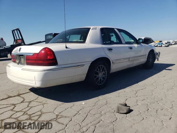 ✅ 2005 Mercury Grand Marquis GS • VIN: 2MEFM74W25X635718 • Лот: 82423115. Опубликован ранее на Copart с пробегом 99 669 миль. Бесплатный доступ к архиву аукционных продаж из США и подробный отчёт об истории автомобиля на DreamBid. Изображение 3.