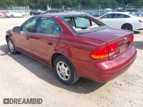 ✅ 2002 Oldsmobile Alero GX • VIN: 1G3NK52F52C303839 • Lot: 42632849. Listed on IAAI with 134,169 mi. Free auction sales archive from the USA and detailed vehicle history report at DreamBid. Image 3.