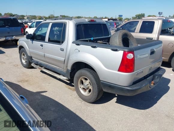 ✅ 2004 Ford Explorer Sport Trac XLS • VIN: 1FMZU77K34UA65740 • Lot: 43589534. Listed on IAAI with 310,281 mi. Free auction sales archive from the USA and detailed vehicle history report at DreamBid. Image 3.