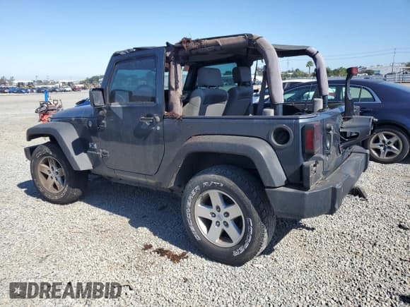 ✅ 2007 Jeep Wrangler X • VIN: 1J4FA241X7L132899 • Lot: 56553345. Listed on Copart with 154,085 mi. Free auction sales archive from the USA and detailed vehicle history report at DreamBid. Image 2.