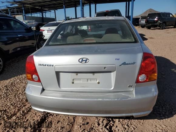 2003 Hyundai Accent GL z VIN KMHCG45CX3U429660, wystawiony jako Copart lot #43824125 z przebiegiem Nie podano mil oraz Szkoda całkowita • Salvage title. Historia ofert i sprzedaży dostępna na DreamBid. Obrazek 6.