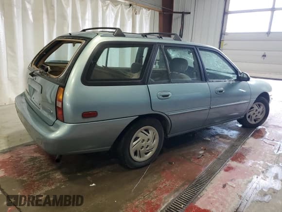 ✅ 1997 Ford Escort LX • VIN: 3FALP15P9VR107467 • Lot: 76061074. Listed on Copart with 69,873 mi. Free auction sales archive from the USA and detailed vehicle history report at DreamBid. Image 3.