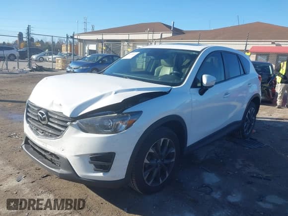 ✅ 2016 Mazda CX-5 Grand Touring • VIN: JM3KE4DY6G0864294 • Lot: 43639964. Wystawiony na IAAI z przebiegiem 119 285 mil. Bezpłatny archiwum sprzedaży aukcyjnych z USA i szczegółowy raport historii pojazdu na DreamBid. Zdjęcie 2.