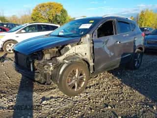 2015 Hyundai Tucson SE with VIN KM8JU3AGXFU050794, listed as a IAAI auction lot 43440138 with 161,385 mi miles and . Bid and sale history available at DreamBid. Image 2.