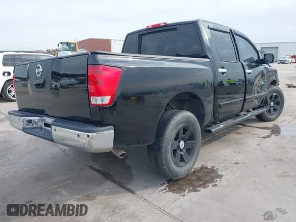 ✅ 2015 Nissan Titan SV • VIN: 1N6BA0ED6FN506832 • Lot: 42145874. Listed on IAAI with 238,722 mi. Free auction sales archive from the USA and detailed vehicle history report at DreamBid. Image 4.