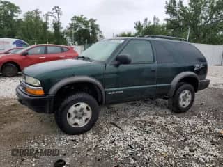 2002 Chevrolet Blazer LS z VIN 1GNCT18W92K128951, wystawiony jako Copart lot #69324585 z przebiegiem 69 957 mil mil oraz Czysty tytuł • Clean title. Historia ofert i sprzedaży dostępna na DreamBid. Obrazek 1.