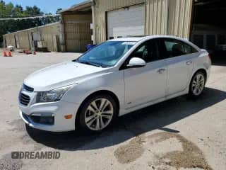 2016 Chevrolet Cruze LTZ z VIN 1G1PG5SBXG7210167, wystawiony jako Copart lot #70765605 z przebiegiem 130 306 mil mil oraz Czysty tytuł • Clean title. Historia ofert i sprzedaży dostępna na DreamBid. Obrazek 1.