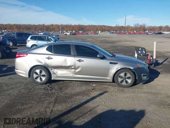 ✅ 2011 Kia Optima EX Hybrid • VIN: KNAGM4AD3B5004820 • Lot: 43600902. Listed on IAAI with 190,302 mi. Free auction sales archive from the USA and detailed vehicle history report at DreamBid. Image 13.