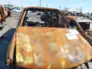 2005 Chevrolet Tahoe LT with VIN 1GNEC13T35R103223, listed as a IAAI auction lot 42165644 with Not provided miles and . Bid and sale history available at DreamBid. Image 14.