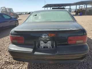 1996 Chevrolet Caprice 1SA Special Value z VIN 1G1BL52P2TR130975, wystawiony jako Copart lot #62403325 z przebiegiem Nie podano mil oraz Czysty tytuł • Clean title. Historia ofert i sprzedaży dostępna na DreamBid. Obrazek 6.