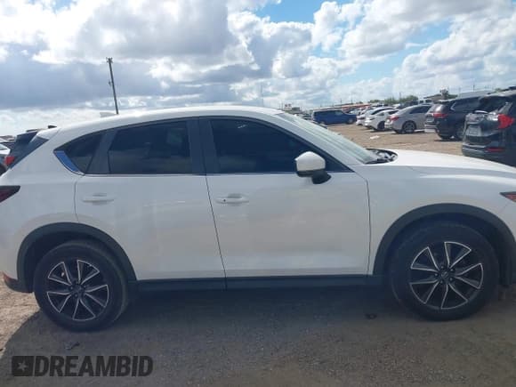 ✅ 2018 Mazda CX-5 Touring • VIN: JM3KFACM6J1409067 • Лот: 43716812. Опубликован ранее на IAAI с пробегом 76 489 миль. Бесплатный доступ к архиву аукционных продаж из США и подробный отчёт об истории автомобиля на DreamBid. Изображение 13.