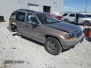 ✅ 2002 Jeep Grand Cherokee Laredo • VIN: 1J4GW48S52C232227 • Lot: 85100645. Listed on Copart with 128,563 mi. Free auction sales archive from the USA and detailed vehicle history report at DreamBid. Image 4.