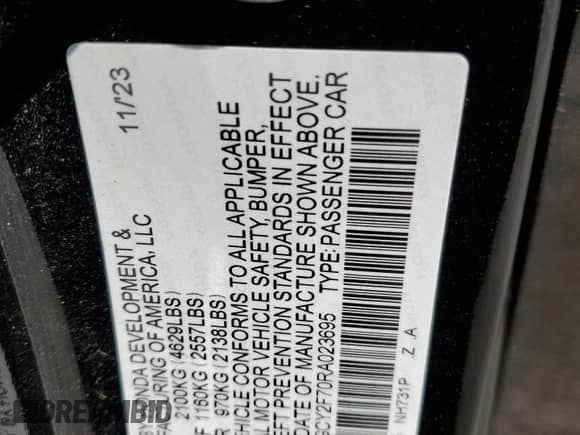 2024 Honda Accord Sport-L with VIN 1HGCY2F70RA023695, listed as a Copart auction lot 71504205 with 58,790 mi miles and Salvage title. Bid and sale history available at DreamBid. Image 12.