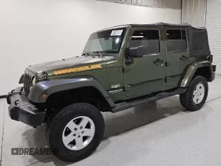 ✅ 2007 Jeep Wrangler Unlimited Sahara • VIN: 1J4GB59157L143188 • Лот: 67048525. Опубликован ранее на Copart с пробегом 219 248 миль. Бесплатный доступ к архиву аукционных продаж из США и подробный отчёт об истории автомобиля на DreamBid. Изображение 1.