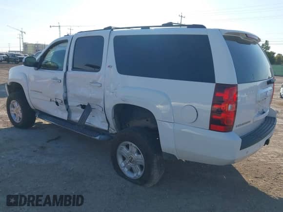 2012 Chevrolet Suburban LT z VIN 1GNSKJE74CR256132, wystawiony jako IAAI lot #43120737 z przebiegiem 195 627 mil mil oraz . Historia ofert i sprzedaży dostępna na DreamBid. Obrazek 3.