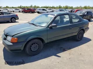 ✅ 1995 Toyota Tercel DX • VIN: JT2EL56D0S0083381 • Lot: 63779675. Listed on Copart with 239,663 mi. Free auction sales archive from the USA and detailed vehicle history report at DreamBid. Image 1.