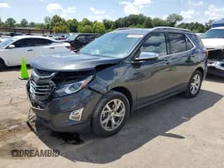 2020 Chevrolet Equinox Premier z VIN 2GNAXXEV7L6220557, wystawiony jako Copart lot #65986635 z przebiegiem 83 796 mil mil oraz Szkoda całkowita • Salvage title. Historia ofert i sprzedaży dostępna na DreamBid. Obrazek 1.
