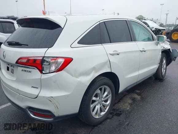 ✅ 2018 Acura RDX • VIN: 5J8TB4H31JL018201 • Lot: 42459595. Listed on IAAI with 106,523 mi. Free auction sales archive from the USA and detailed vehicle history report at DreamBid. Image 4.