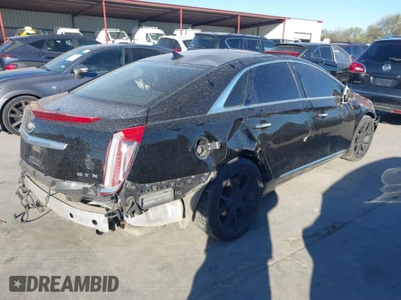 ✅ 2014 Cadillac XTS Luxury • VIN: 2G61M5S35E9168570 • Lot: 42495684. Listed on IAAI with 207,831 mi. Free auction sales archive from the USA and detailed vehicle history report at DreamBid. Image 4.