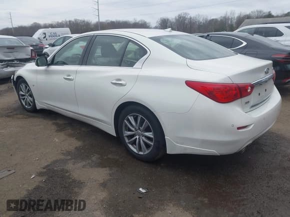 ✅ 2014 Infiniti Q50 Premium • VIN: JN1BV7AR7EM692504 • Lot: 43789438. Listed on IAAI with 104,772 mi. Free auction sales archive from the USA and detailed vehicle history report at DreamBid. Image 3.