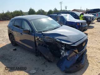 ✅ 2022 Mazda CX-5 S Carbon Edition • VIN: JM3KFBCM2N1540704 • Lot: 43277922. Listed on IAAI with 34,897 mi. Free auction sales archive from the USA and detailed vehicle history report at DreamBid. Image 1.