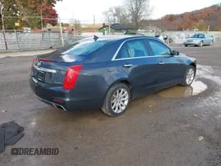 ✅ 2014 Cadillac CTS Luxury AWD • VIN: 1G6AX5SXXE0185580 • Lot: 43643344. Listed on IAAI with 94,591 mi. Free auction sales archive from the USA and detailed vehicle history report at DreamBid. Image 4.