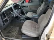 ✅ 1989 Jeep Cherokee Laredo • VIN: 1J4FJ58L5KL637884 • Лот: 57269185. Опубликован ранее на Copart с пробегом 183 716 миль. Бесплатный доступ к архиву аукционных продаж из США и подробный отчёт об истории автомобиля на DreamBid. Изображение 7.