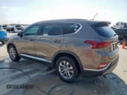 ✅ 2019 Hyundai Santa Fe SE • VIN: 5NMS23ADXKH097314 • Lot: 80940485. Listed on Copart with 114,759 mi. Free auction sales archive from the USA and detailed vehicle history report at DreamBid. Image 2.