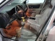 ✅ 2004 Cadillac SRX • VIN: 1GYDE637440141409 • Lot: 82288895. Listed on Copart with 217,209 mi. Free auction sales archive from the USA and detailed vehicle history report at DreamBid. Image 7.