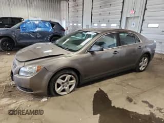 ✅ 2012 Chevrolet Malibu 1LS • VIN: 1G1ZB5E01CF267083 • Lot: 82617705. Listed on Copart with 130,725 mi. Free auction sales archive from the USA and detailed vehicle history report at DreamBid. Image 1.
