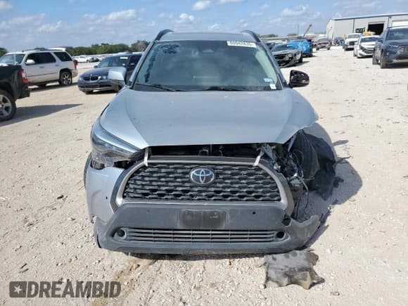 ✅ 2023 Toyota Corolla Cross XLE • VIN: 7MUDAAAG2PV063498 • Лот: 80942835. Опубликован ранее на Copart с пробегом 33 249 миль. Бесплатный доступ к архиву аукционных продаж из США и подробный отчёт об истории автомобиля на DreamBid. Изображение 5.